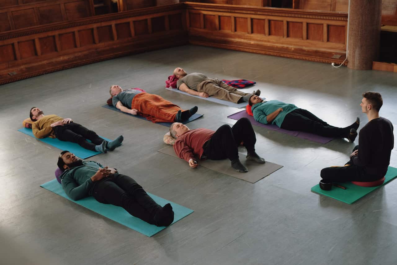 All male Yoga class - Savasana