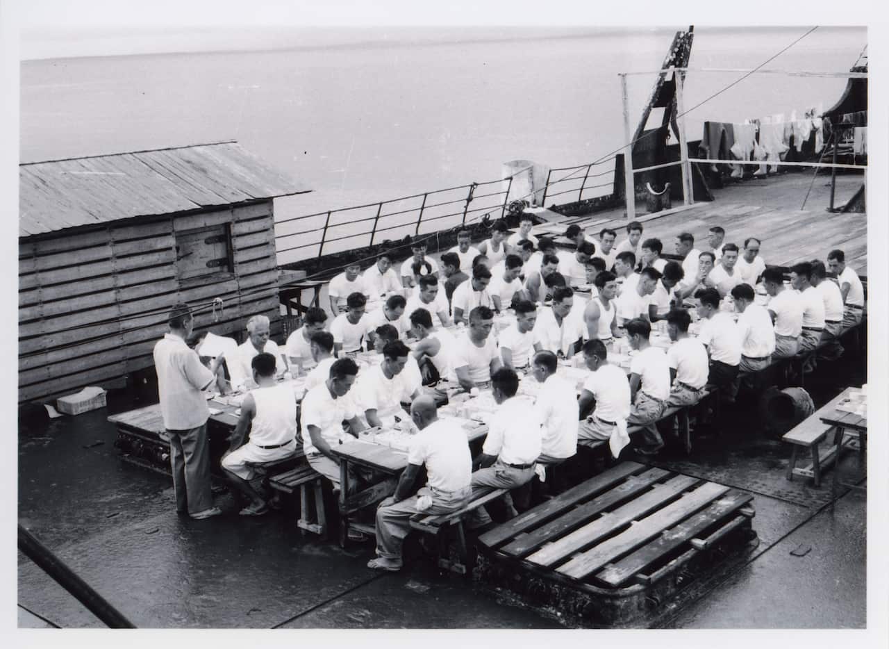 Employees of the Fujita Salvage Company celebrate New Year’s Day on board the MV British Motorist, 1961