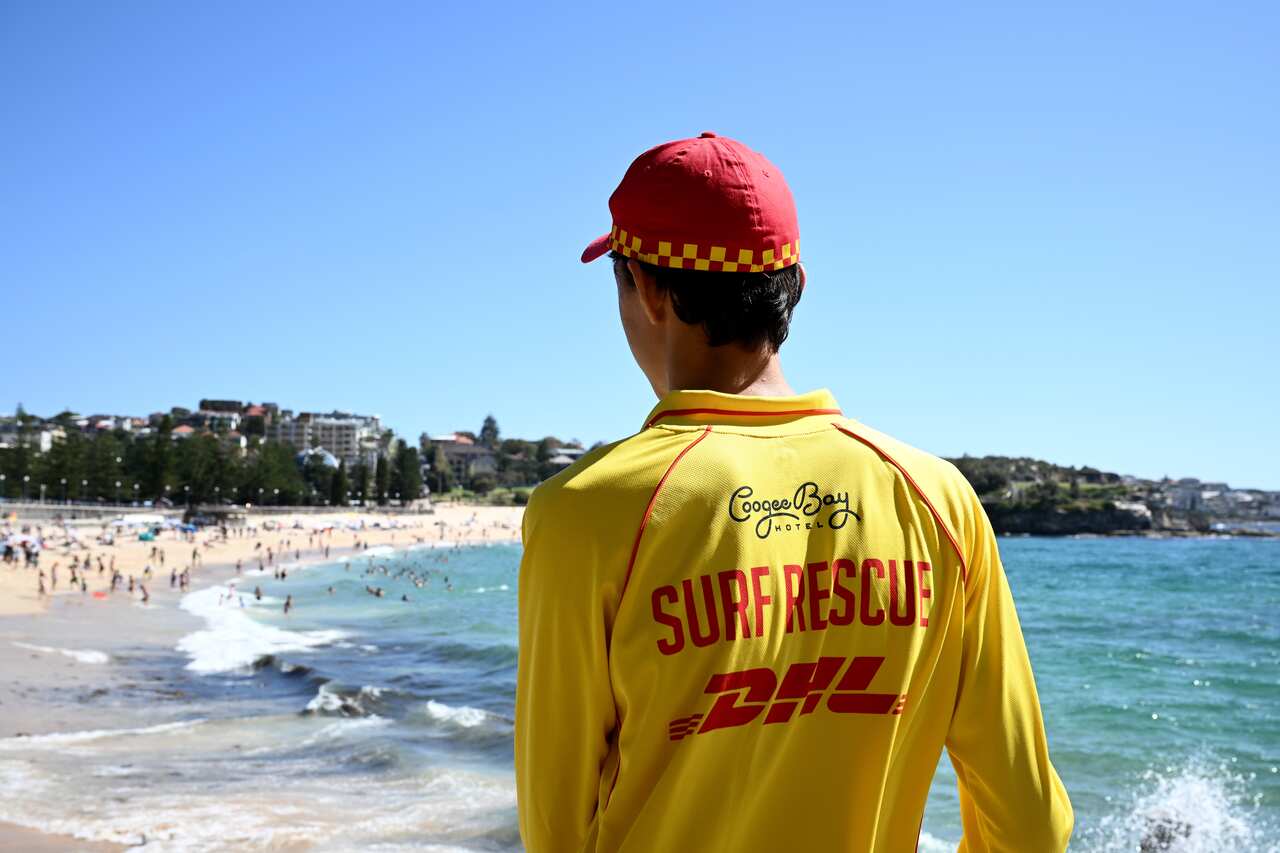 A young surf lifesaver looking out at Coogee Beach