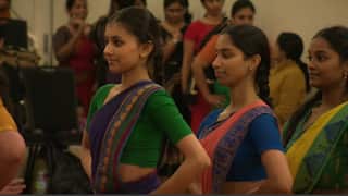 Dancers wearing saris.