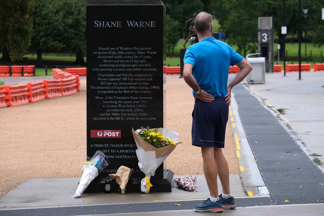 Fans pay their respects to Shane Warne outside the MCG in Melbourne 5 March 2022.  