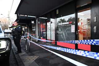 An office vandalised with police red tape surrounding it