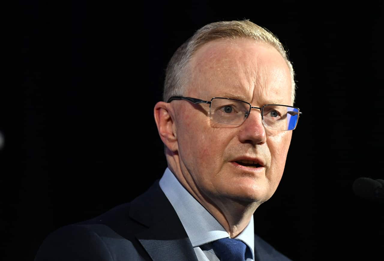 Close up of Philip Lowe against a black backdrop