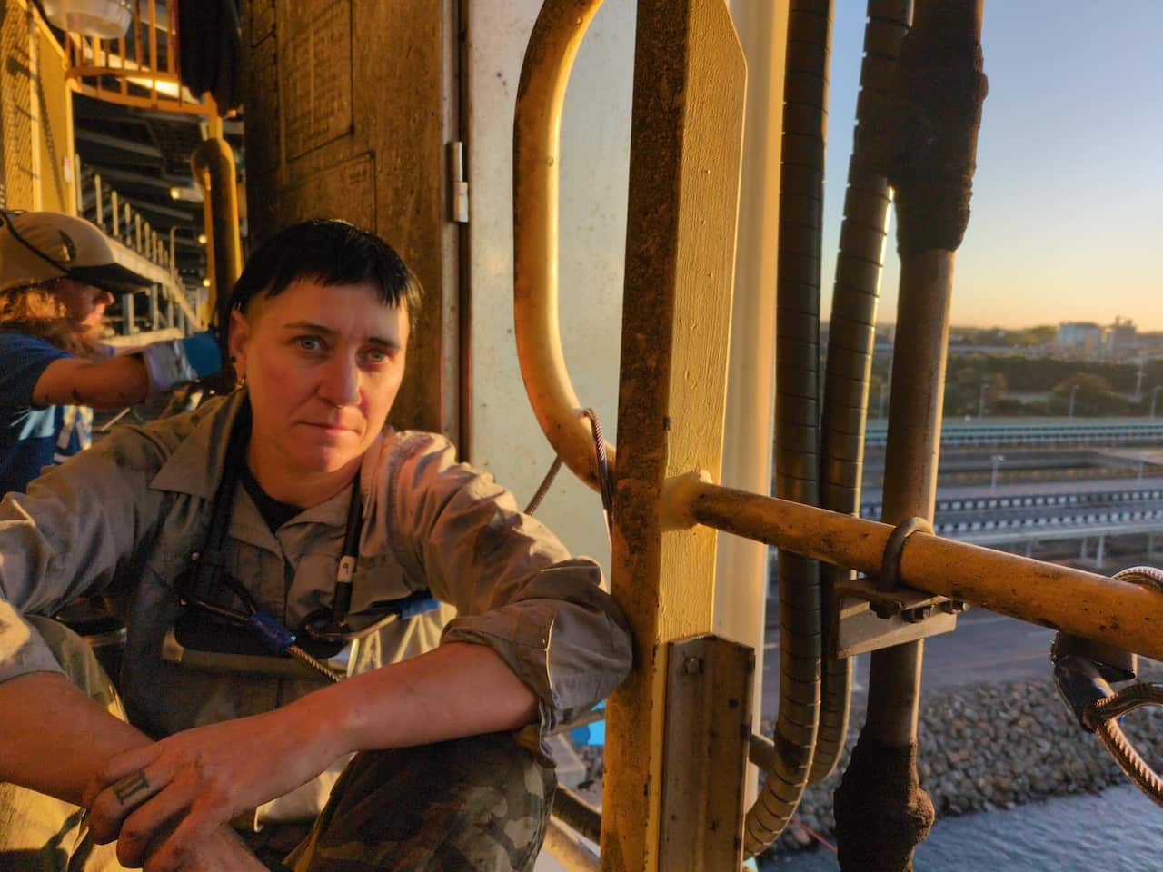 A woman attached to a railing 