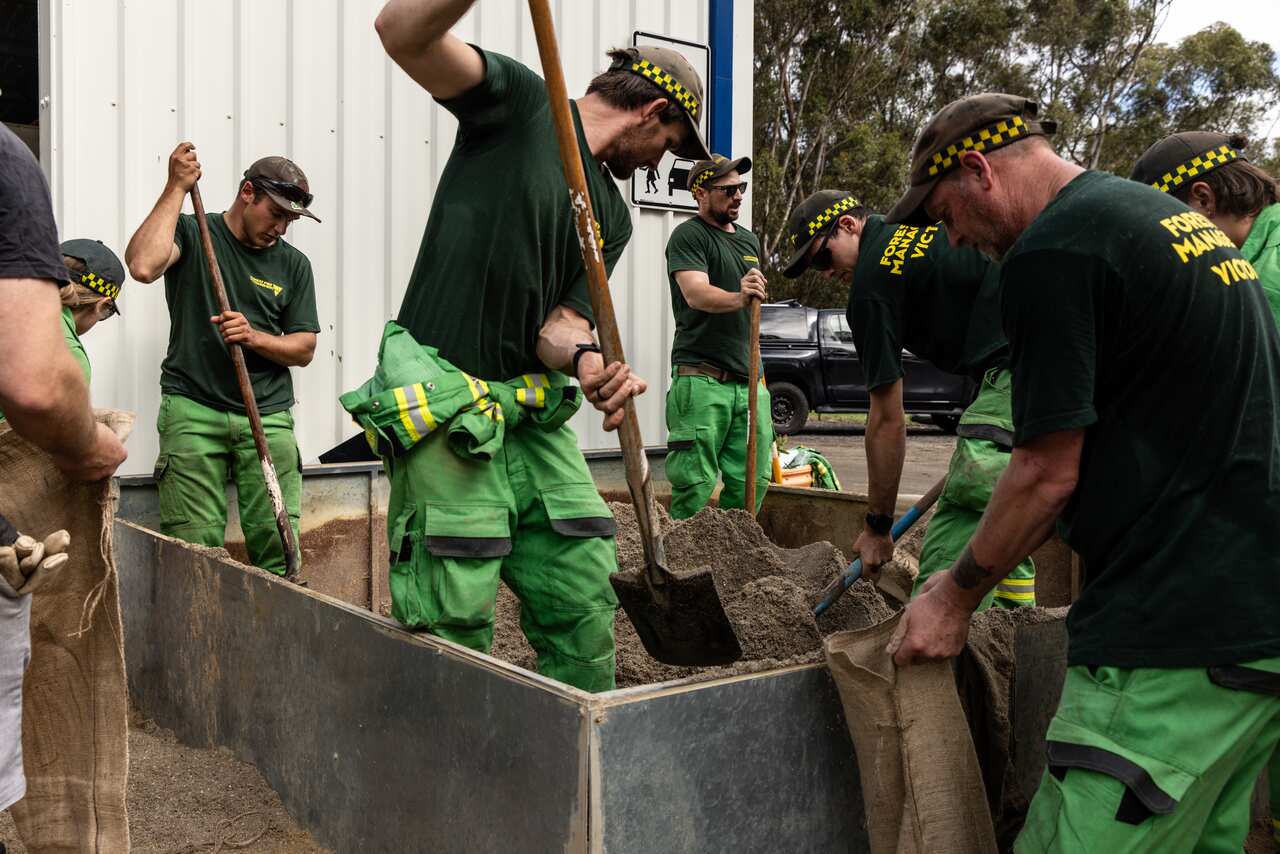 Members of Forest Management Victoria getting sandbags ready.