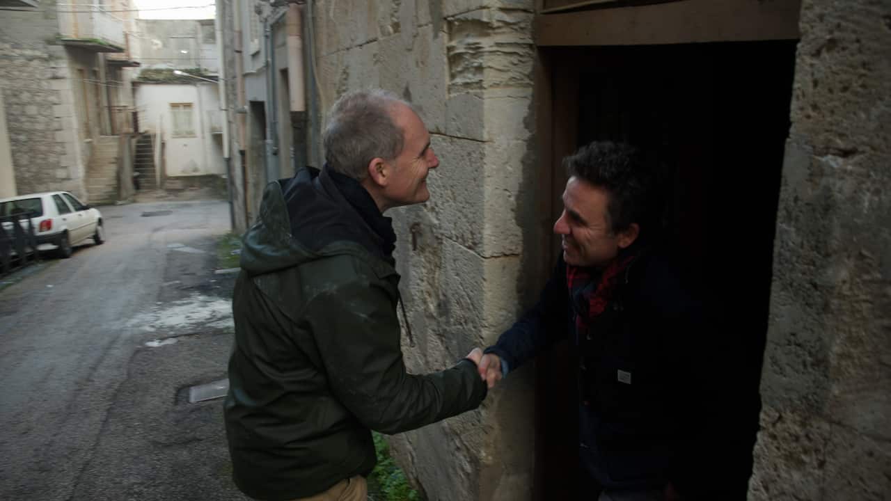 Danny McCubbin and Dateline correspondent Evan Williams inspect the house he bought for one Euro in Mussomeli, Italy.