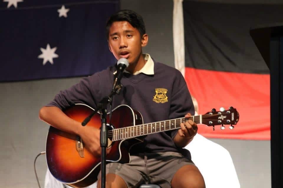 Red roy 14 singing national anthem.jpg