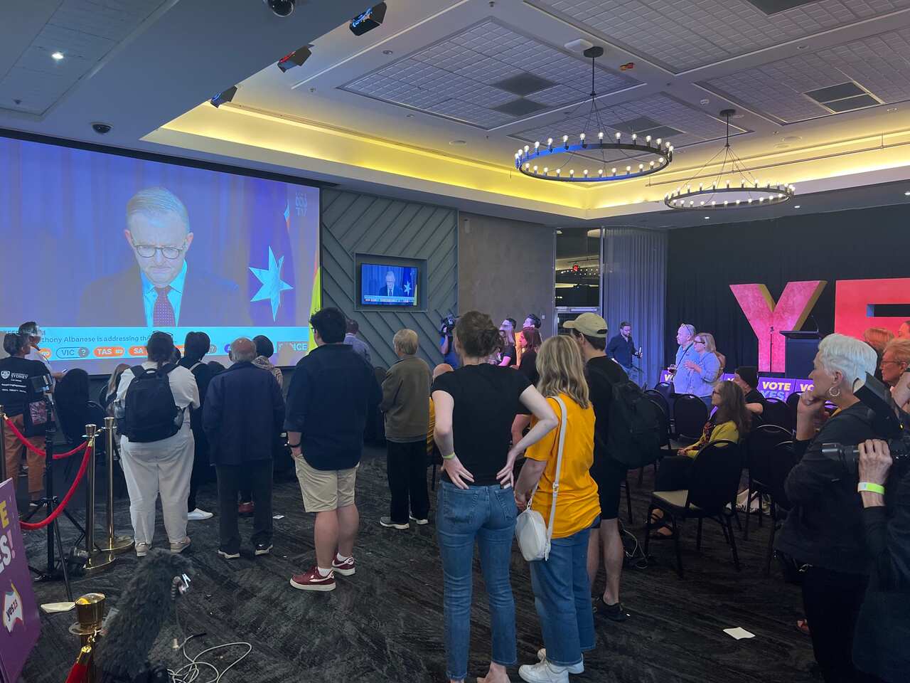 The team at Yes HQ in Sydney watch Anthony Albanese address the nation