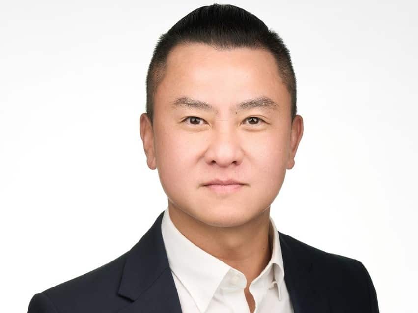 Headshot of man wearing a suit