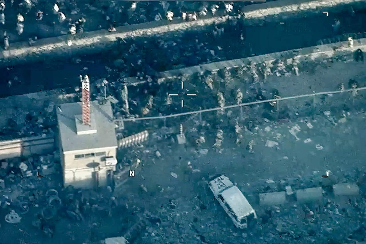 A screenshot from a video of the Taliban bombing at the airport