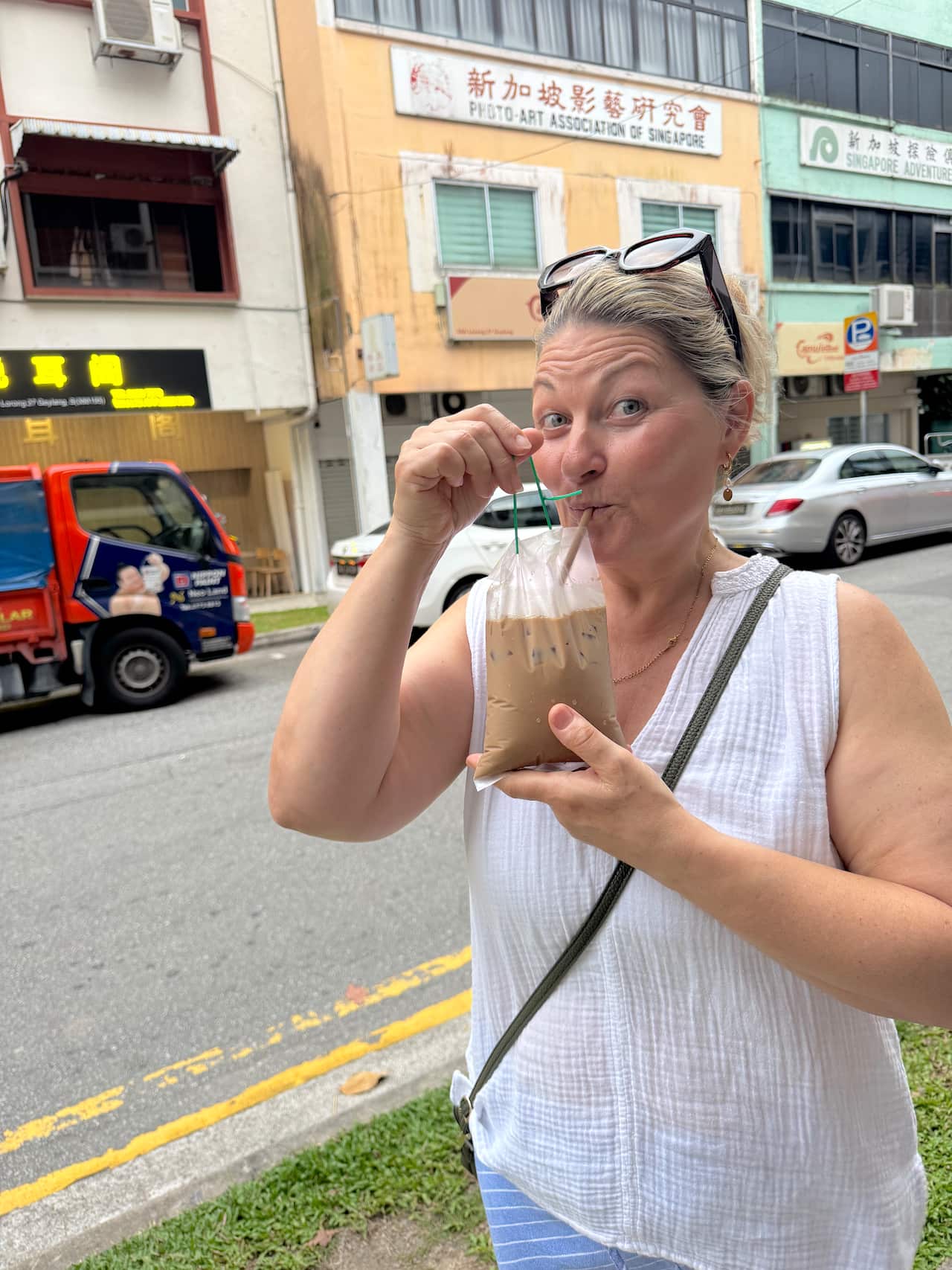 Rebecca Foreman drinking Yuan Yang - half coffee half tea on Hush! Geylang Night Food Tour.jpg