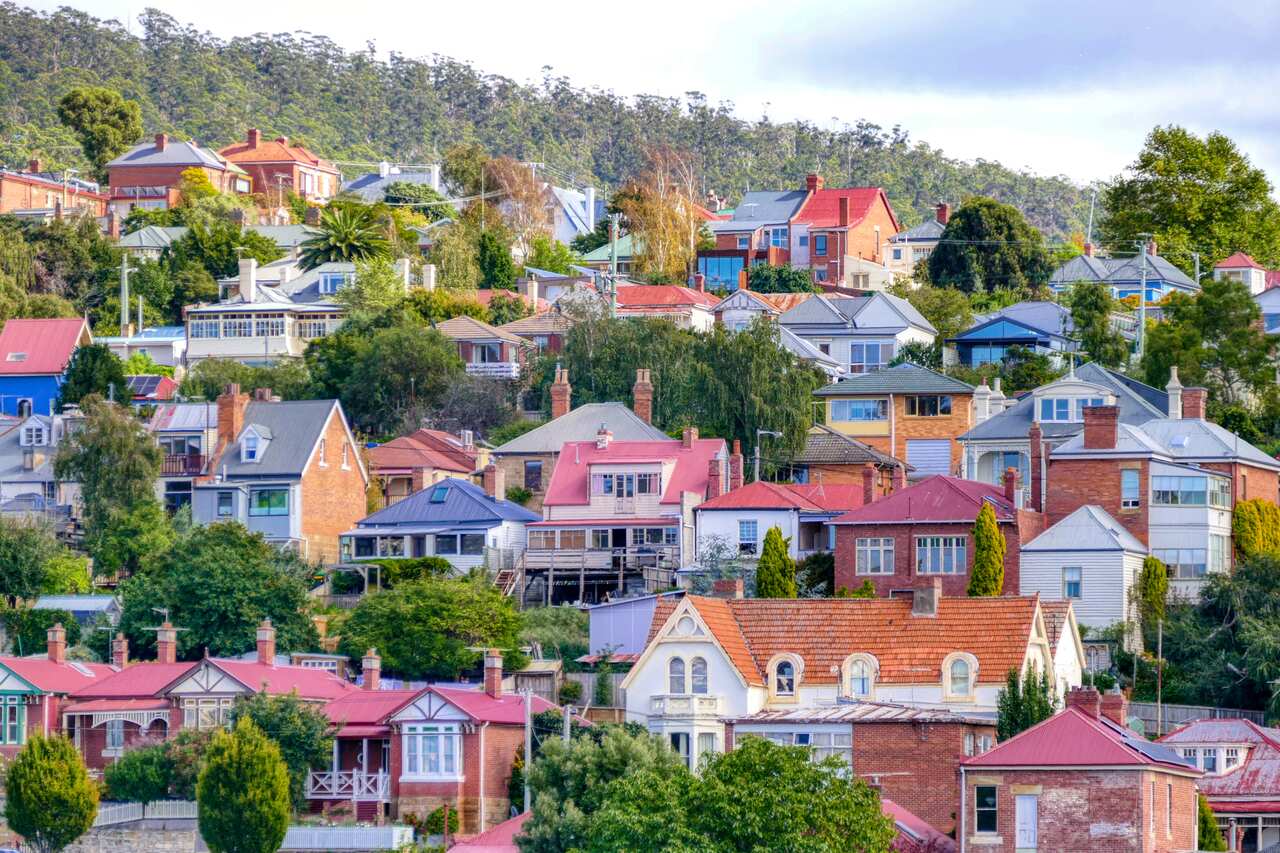 A row of houses on a hillside. 