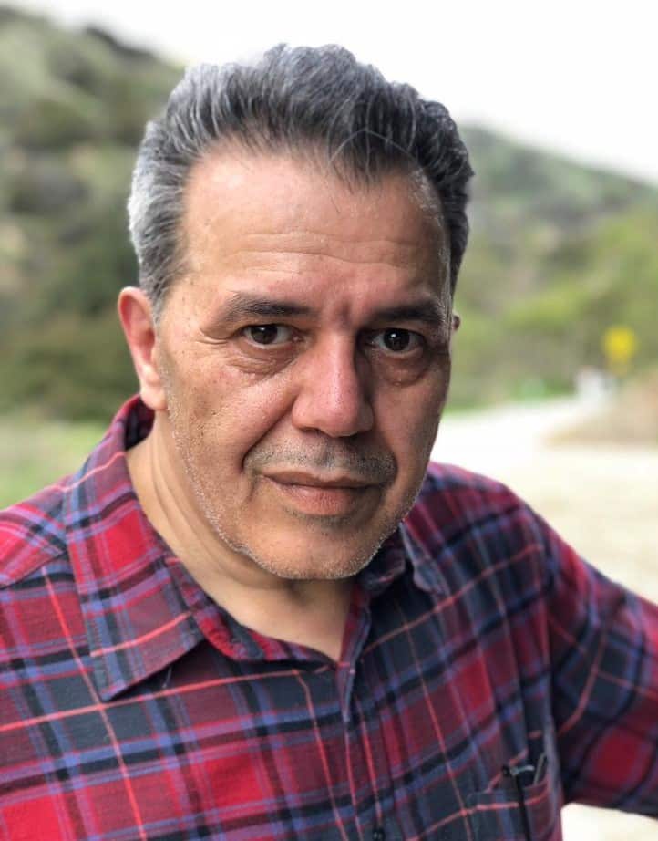 A man in a red checked shirt.