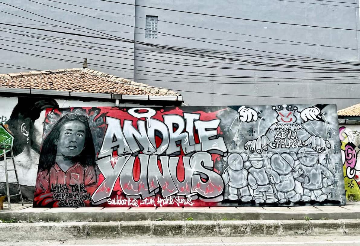 A mural of Andrie Yunus on the street where he was attacked in central Jakarta.