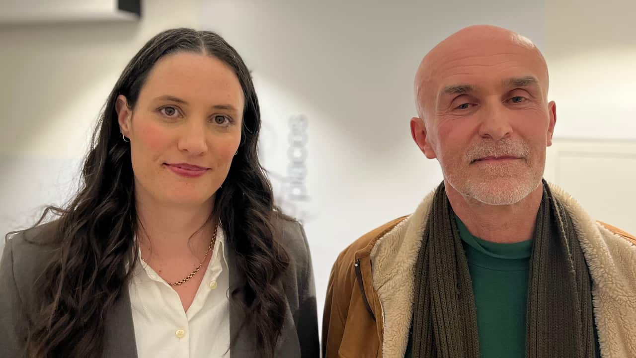 a closeup of a young brunette woman and a middle aged bald man side by side