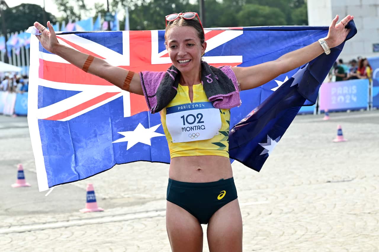 Athlete poses with Australian flag.