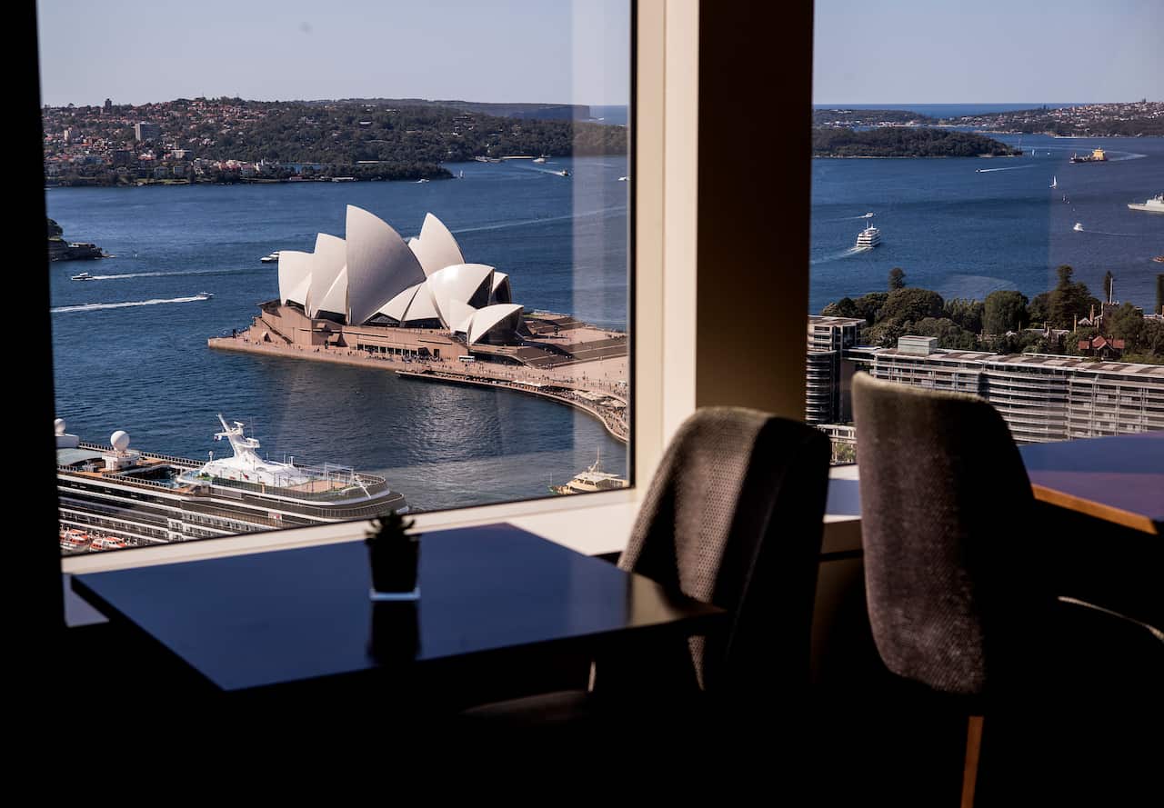 A  window with a view of the Sydney Opera House.