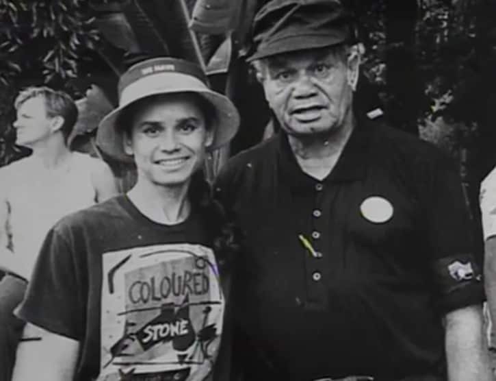 A photograph of a father and his daughter, posing and smiling.