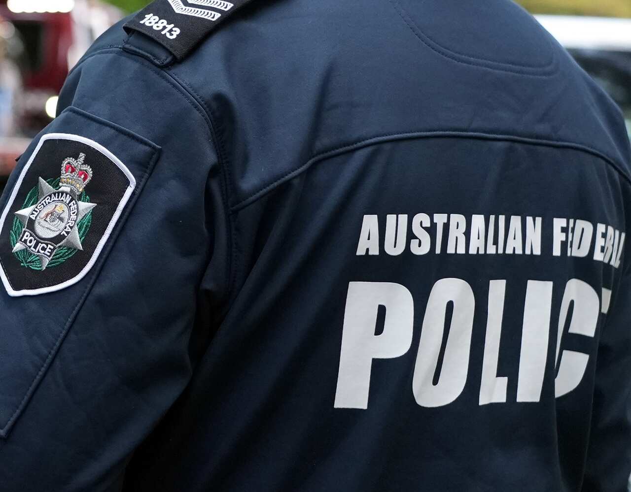 A man wearing a police jacket