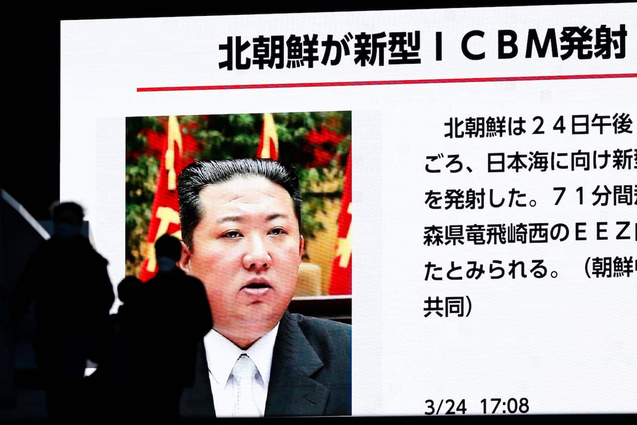 A large screen on a street in Tokyo shows news that an intercontinental ballistic missile test-fired by North Korea fell within Japan's exclusive economic zone in the Sea of Japan