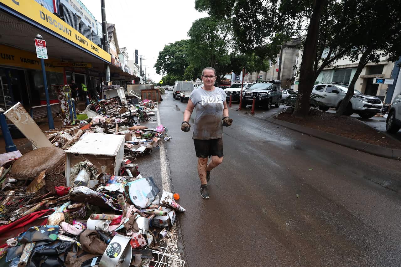 Lismore locals help with the clean-up in the Central Business District in Lismore, Northern NSW.
