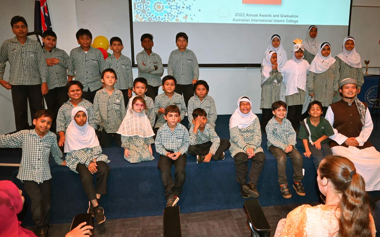 A group of children in a room.