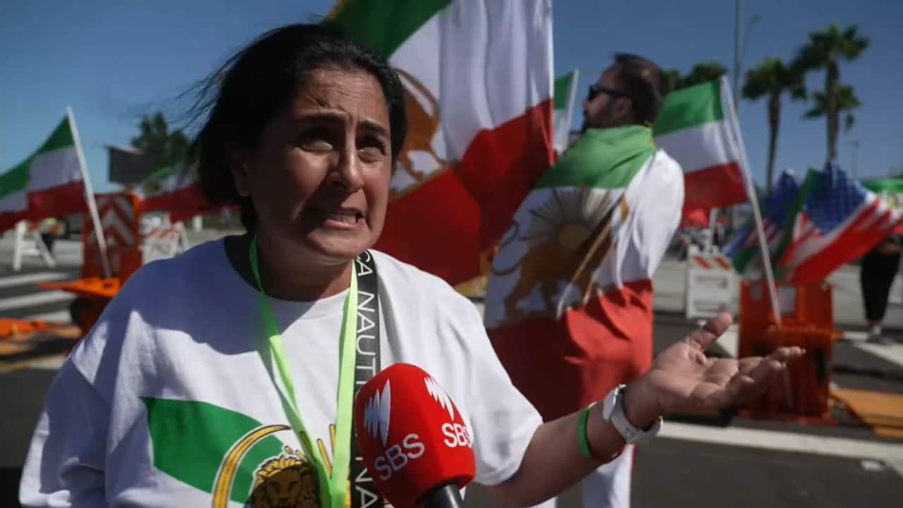 A woman protesting against the Iranian regime outside a football match