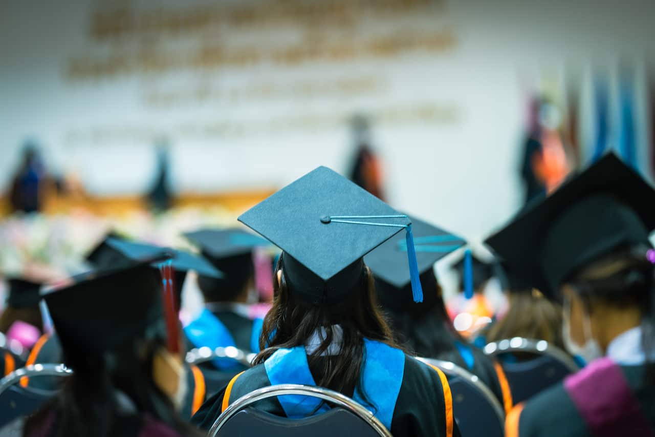 Concept education congratulation and Graduation Ceremony. Congratulated the graduates in University during commencement,backside graduation black hats during commencement success graduates of the university,