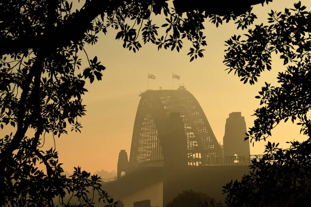 Sydney Harbour Bridge surrounded by smog.