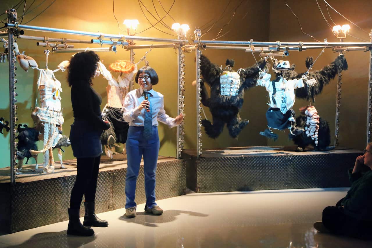 Natasha Tontey speaks to visitors during the opening of "Syncretic Wilds" at Monash University Museum of Art (MUMA), Melbourne, on 18 July 2026.