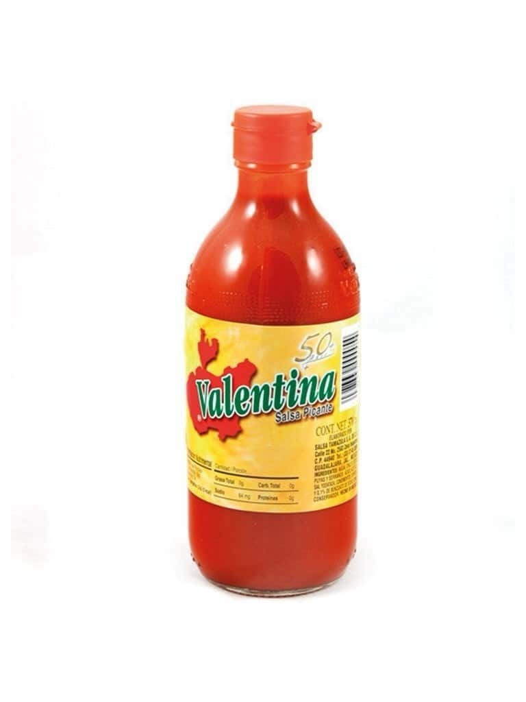 Bottle of chilli sauce on a white background.