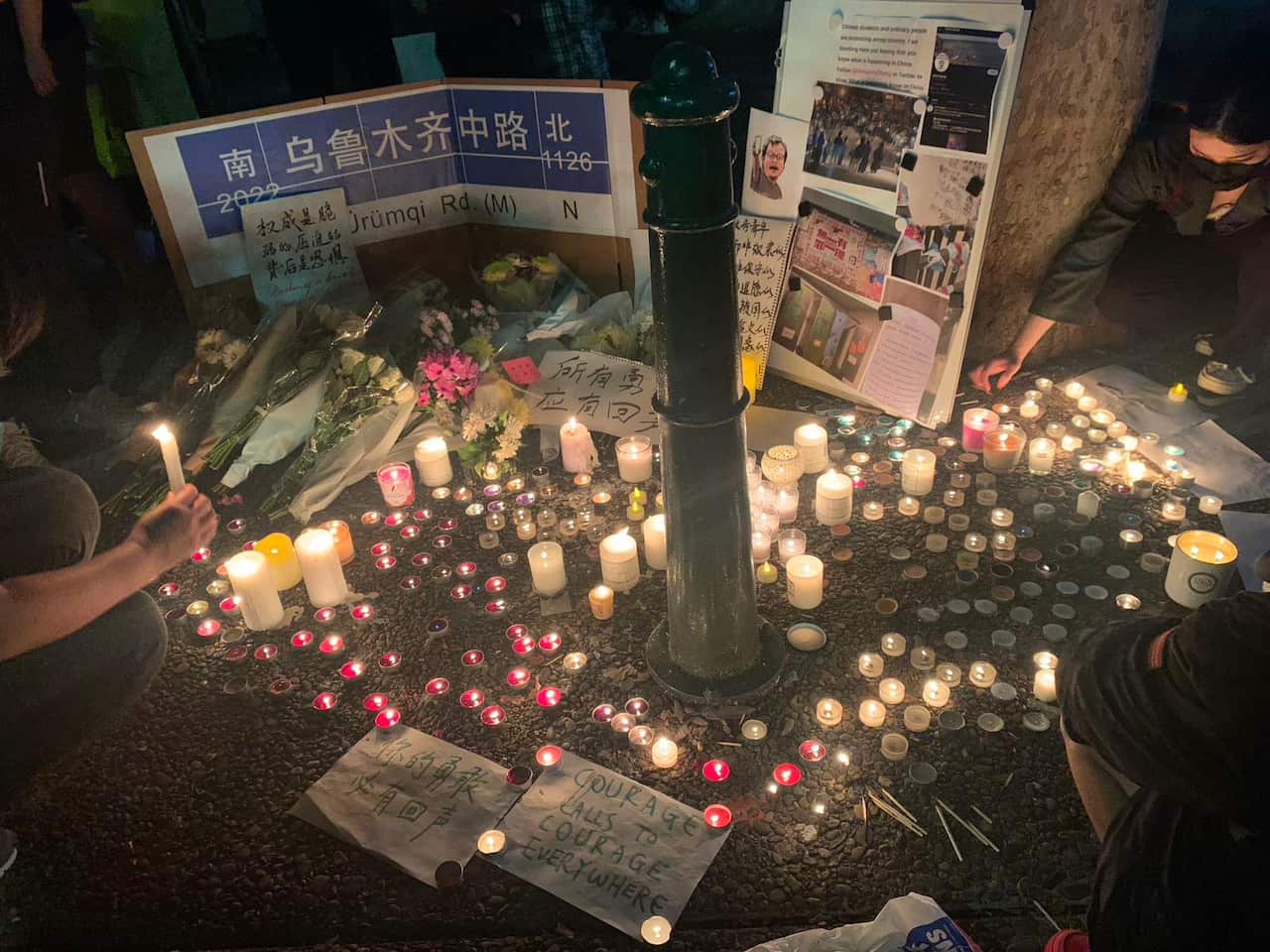 Sydney mourners lit candles in showing solidaity with China's "White paper movement", Monday, November 29, 2022.