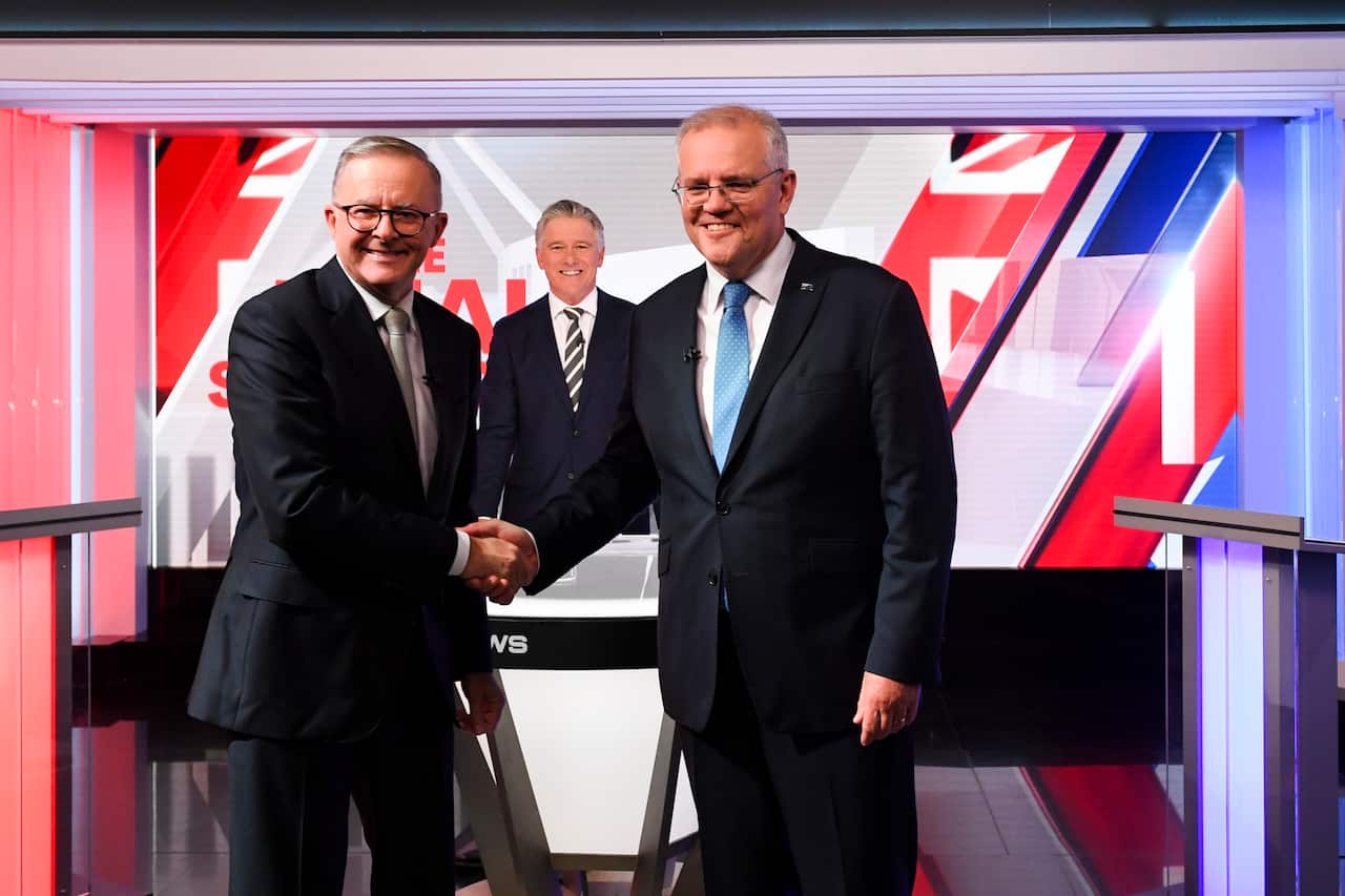 Prime Minister Scott Morrison (right) and Opposition leader Anthony Albanese shake hands at the start of the third leaders' debate at Seven Network Studios, Sydney