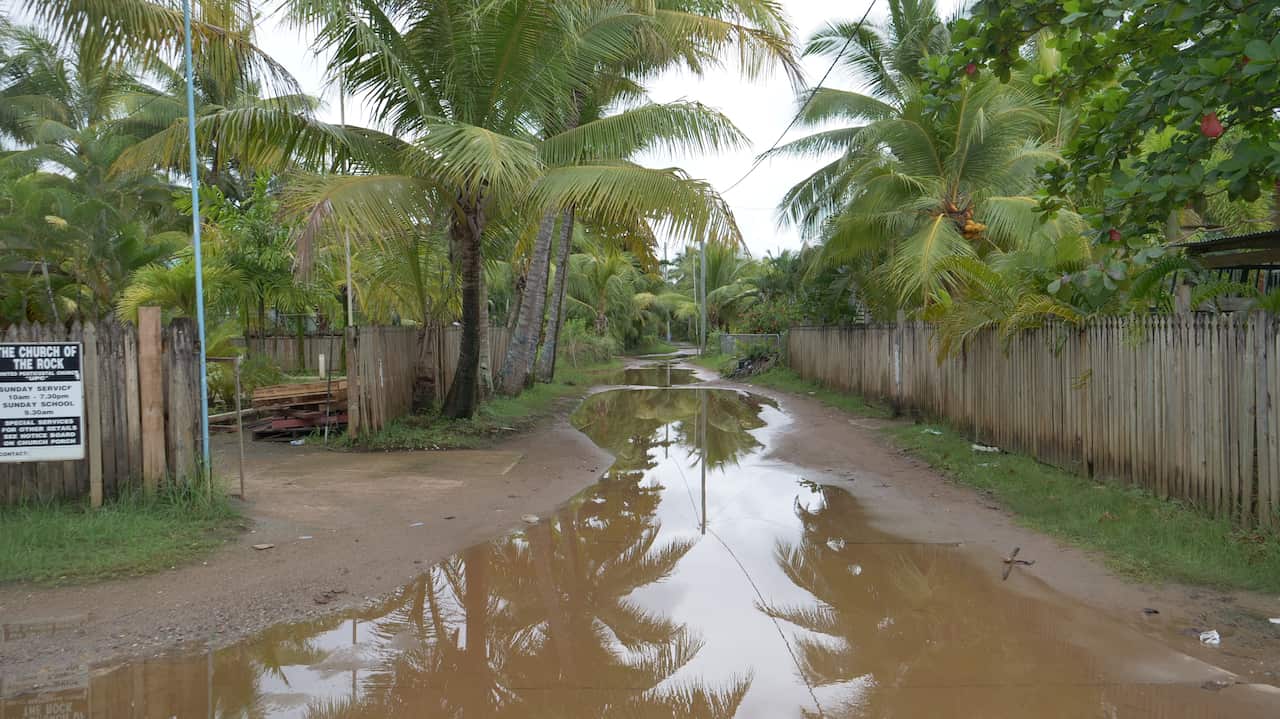 Boigu street after rain. Risk of infection from dirty water has increased because of the water that has started pooling after rainfall and flooding..JPG