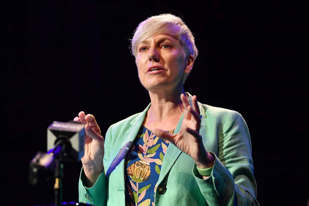 Woman on stage speaking