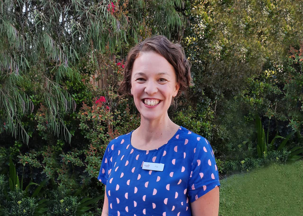 Pip Reid smiling in the garden