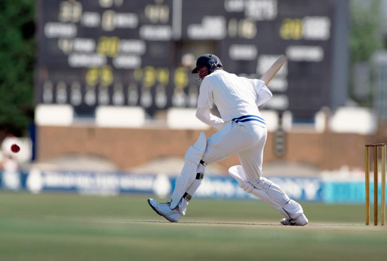 A batsman preparing to hit a cricket ball