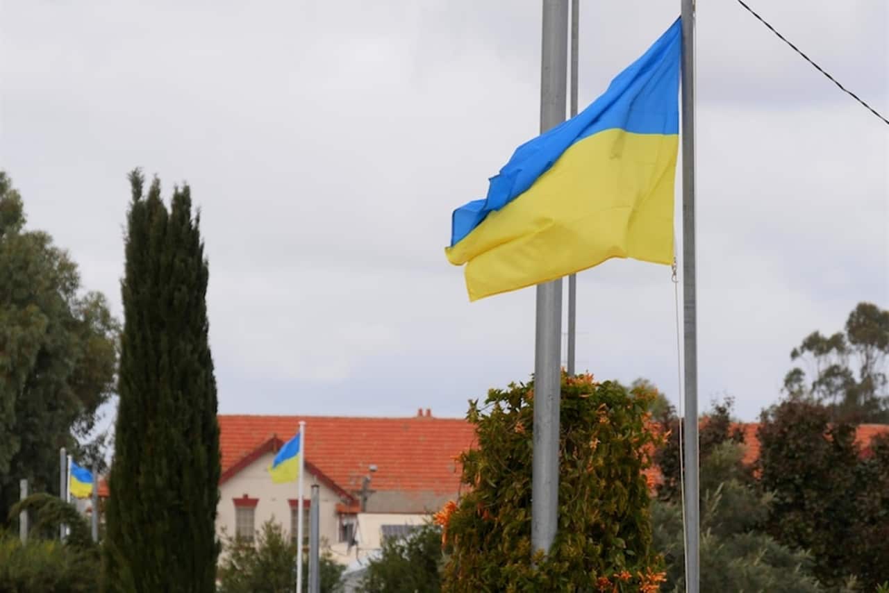 Flags hang every few houses along the town's Commercial Street.jpg