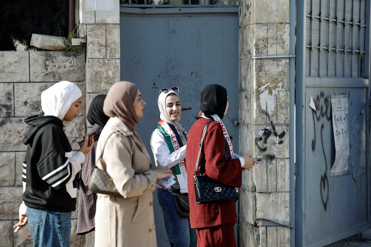 Five women outside a voting centre