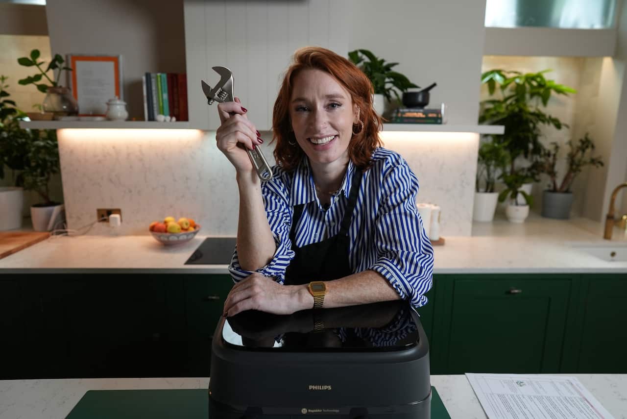 Hannah Fry in London with an airfryer and a wrench in Season 3, Episode 1 of The Secret Genius of Modern Life, titled "Airfryer"