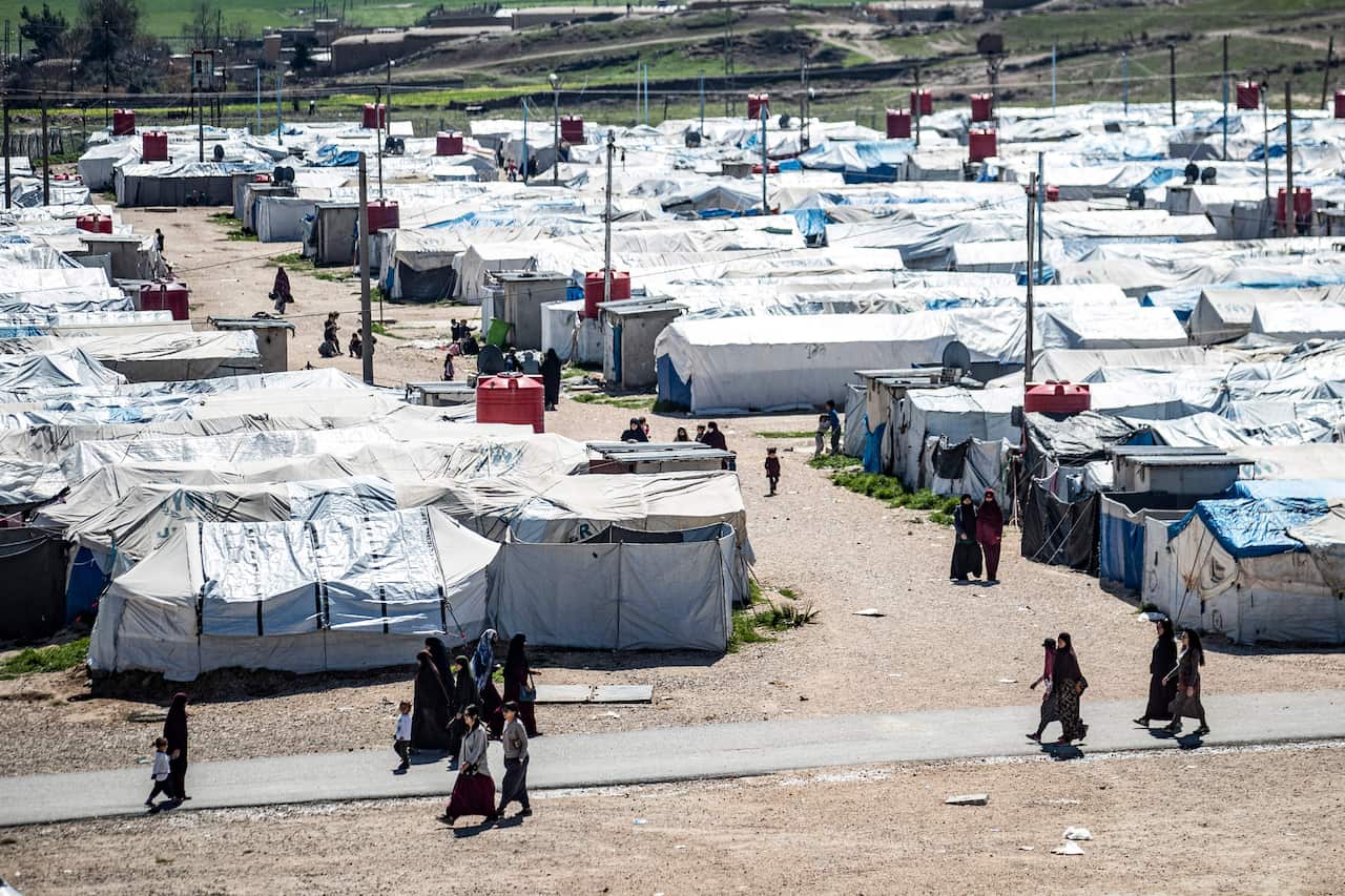 Tents and people at the al-Roj camp in Syria.