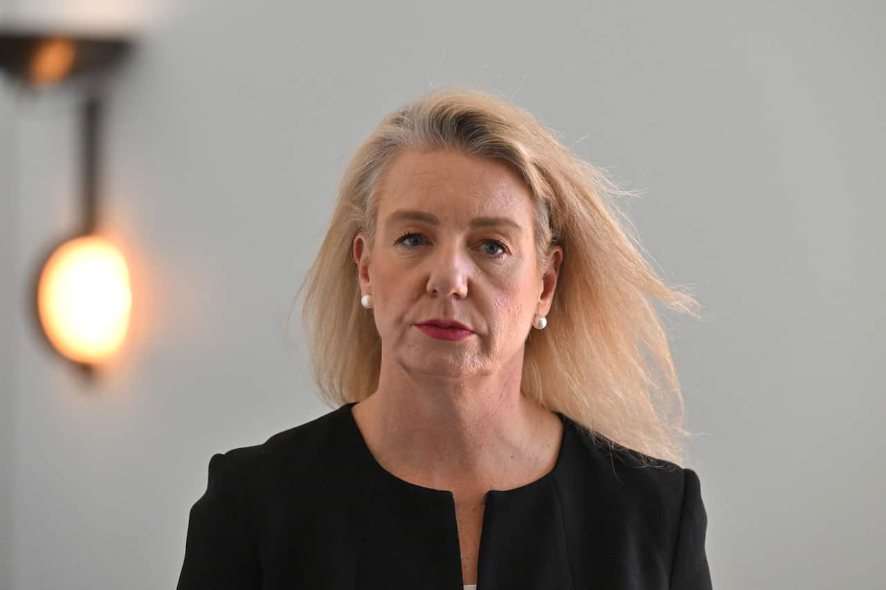 A woman wearing a black blazer