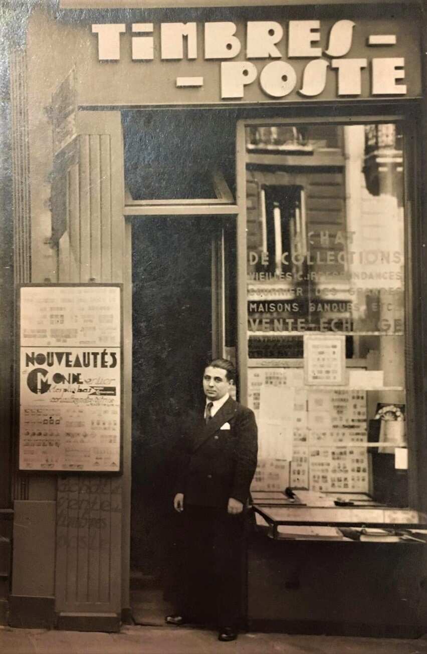 Michel's grandfather at his first stamp shop