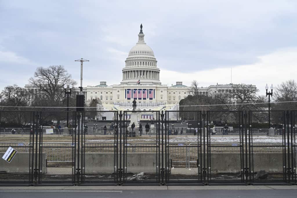A prominent building with tightened security surrounding it.