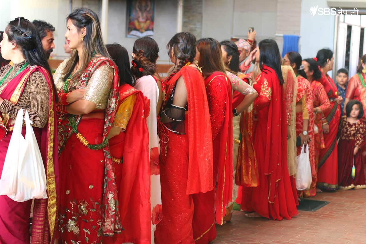 Women wait in line to worship during Teej at Sydney's Mukti-Gupteshwar temple.