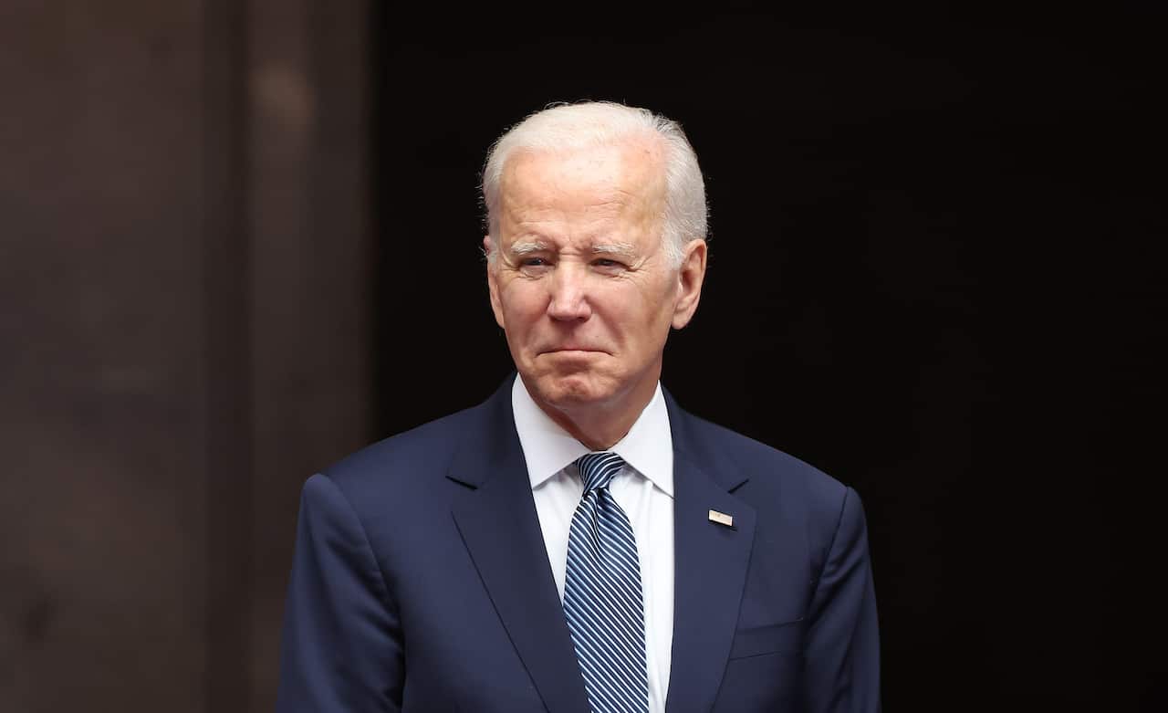 A man in a blue blazer