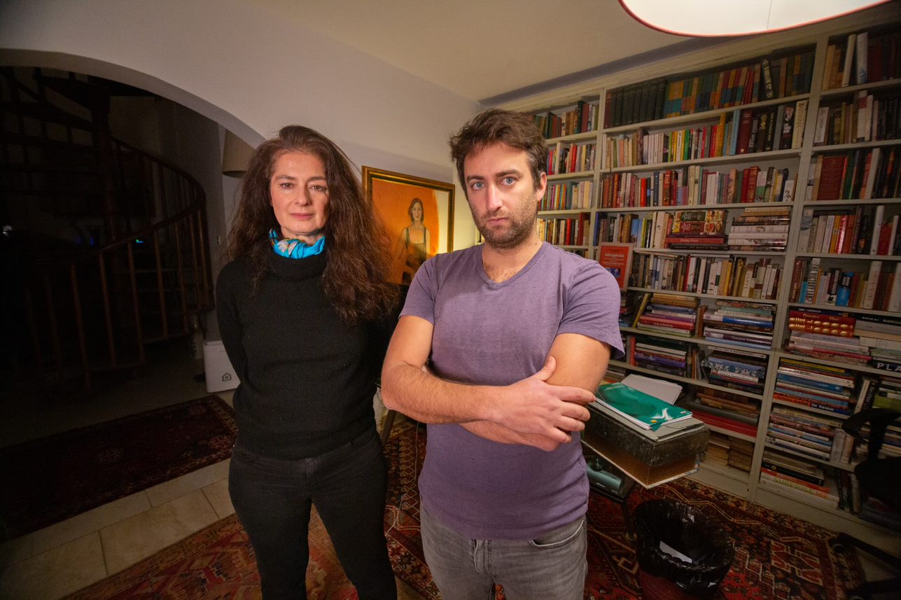 Corrine Vella and Matthew Caruana Galizia in a room with books on bookshelves in the background