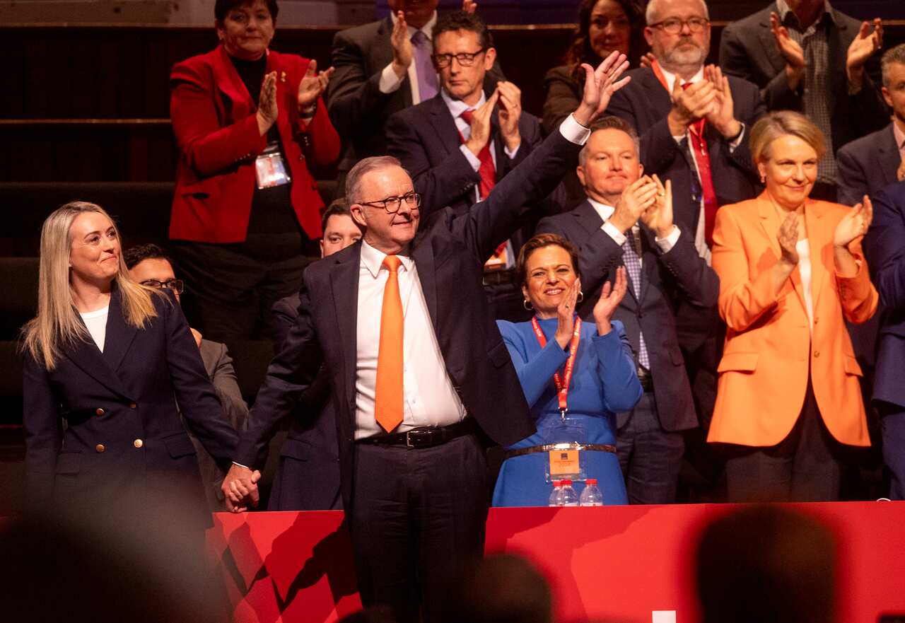 Albanese waves at a crowd.