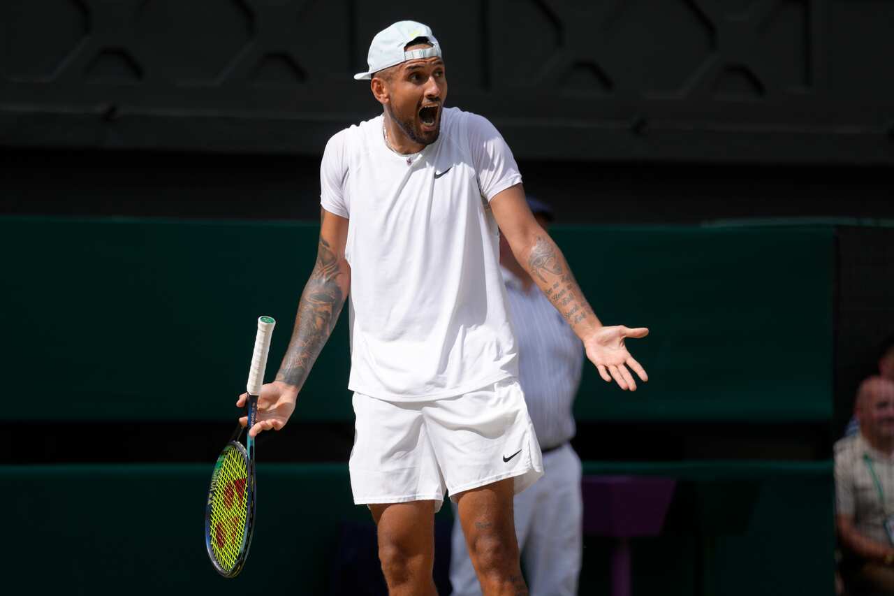 Nick Kyrgios shouting during a tennis match.