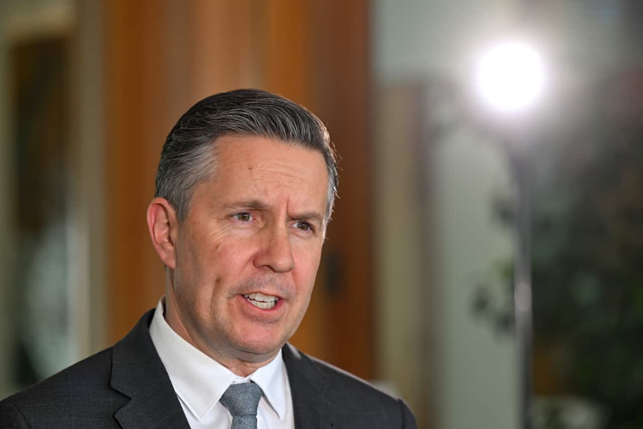 Man in a suit speaking